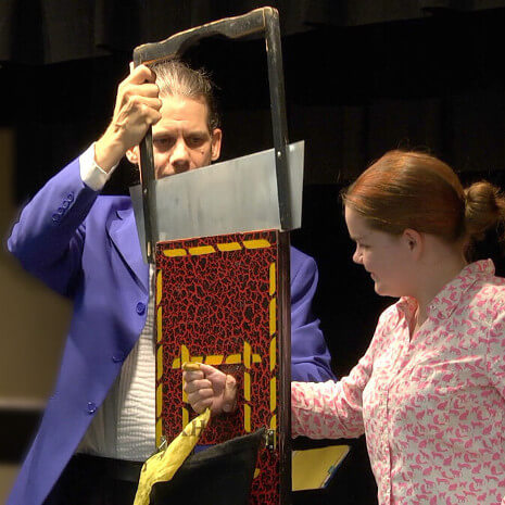 Chicago area girl helps magician perform the arm chopper illusion!